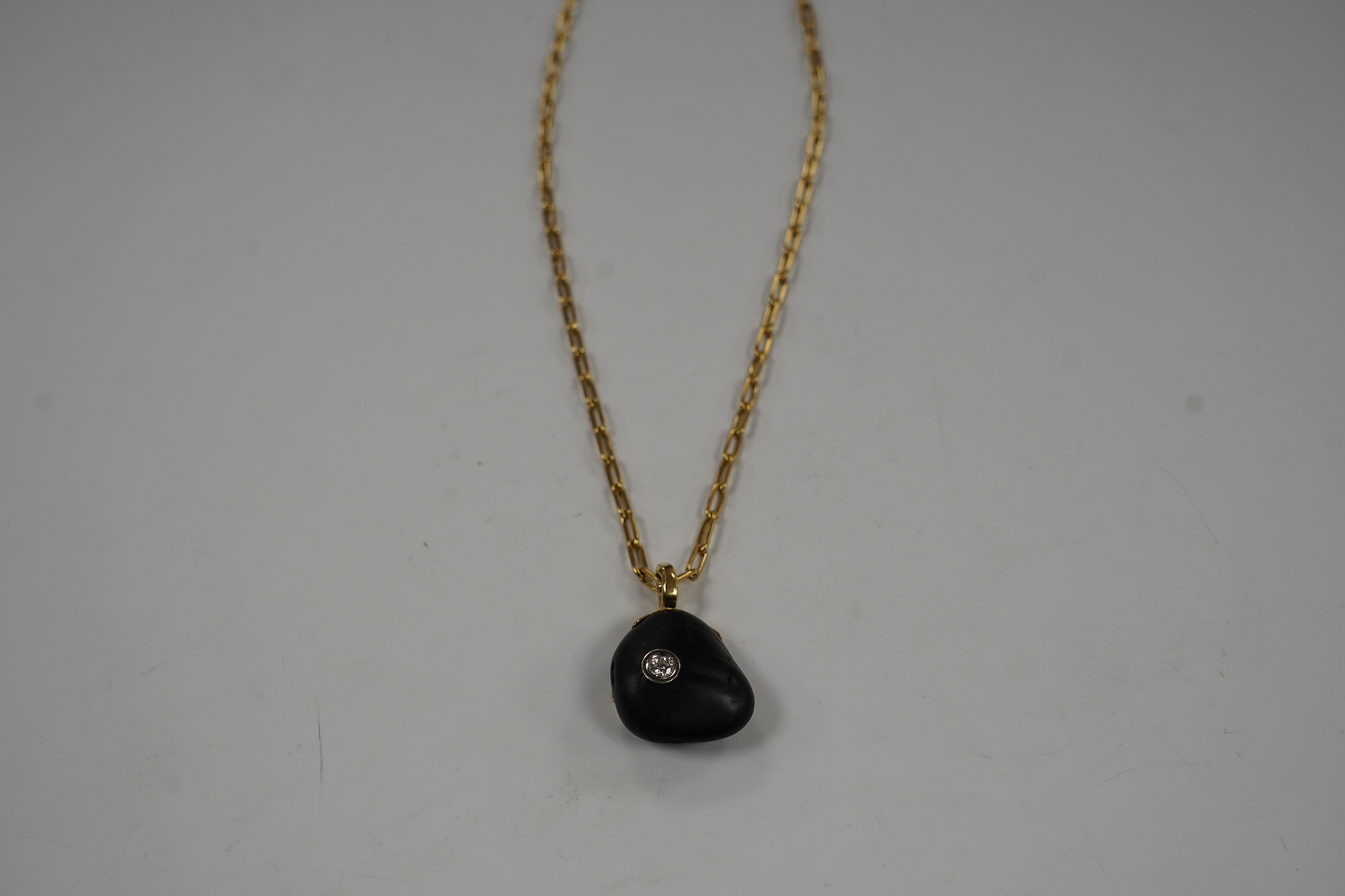 A modern Chou Chou 18k and pt mounted inset diamond pebble? pendant, 38mm overall, on a Chou Chou 18k chain, 62cm, chain weight 27 grams.